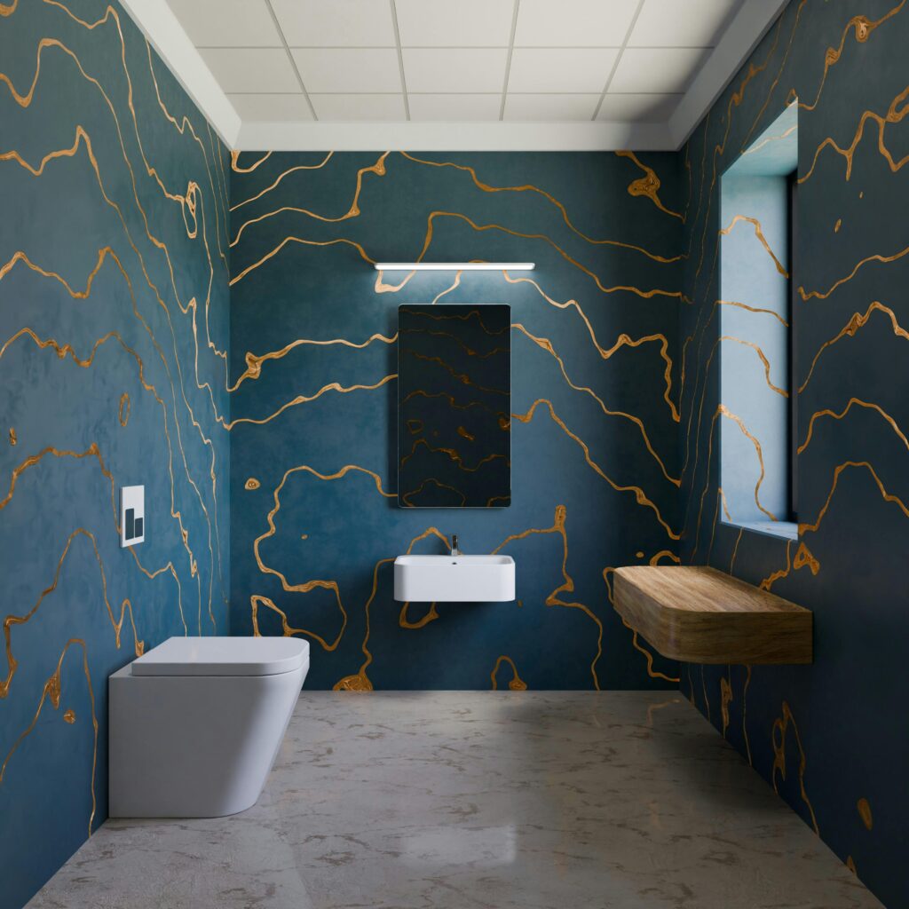 A contemporary bathroom featuring unique blue and gold artistic walls with sleek fixtures.