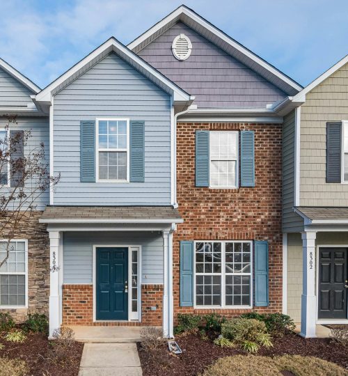 Elegant view of suburban townhouses showcasing diverse architectural styles.